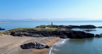 The image shows the back end of Llanddwyn island capturing the lighthouse