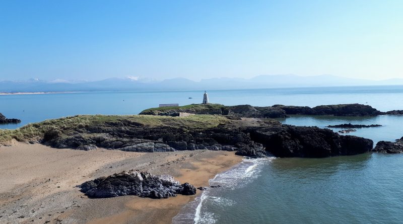 The image shows the back end of Llanddwyn island capturing the lighthouse